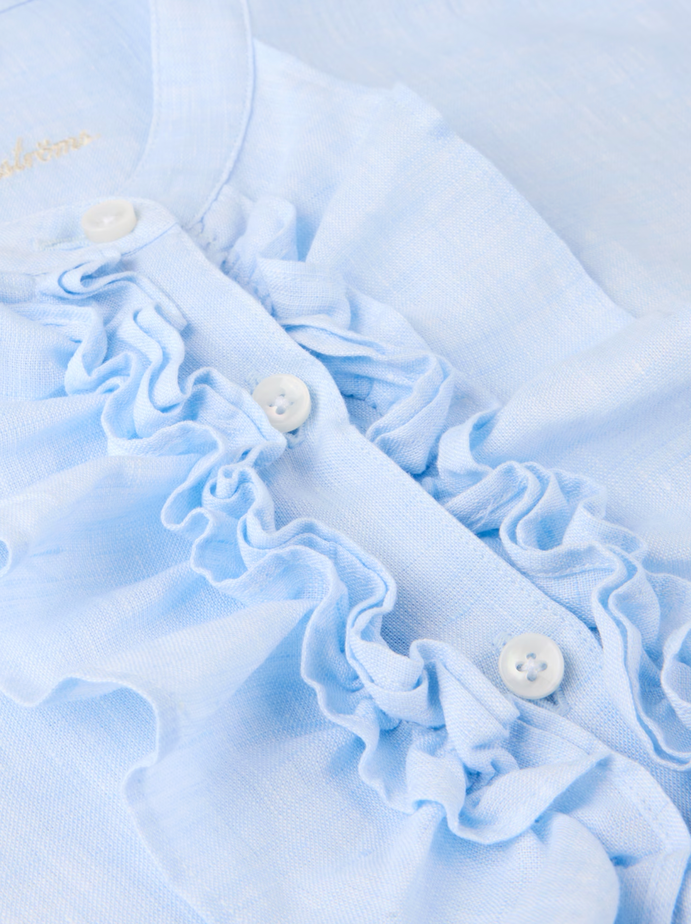 Hillary ljusblå linneskjorta med krusiduller